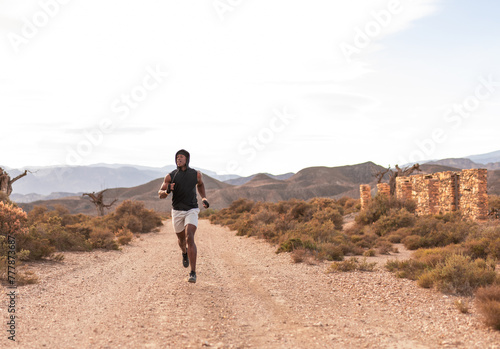 young man training in the desert