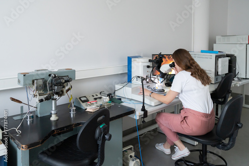 Scientist Working With High Resolution Microscope photo