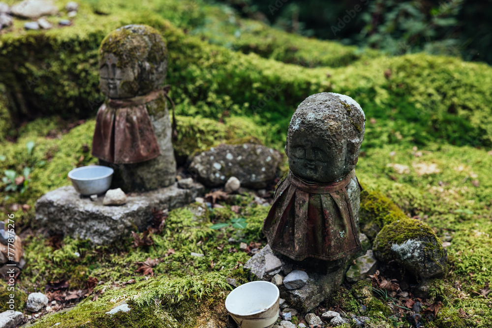 Two Stone Jizo Statue in Mossy Garden