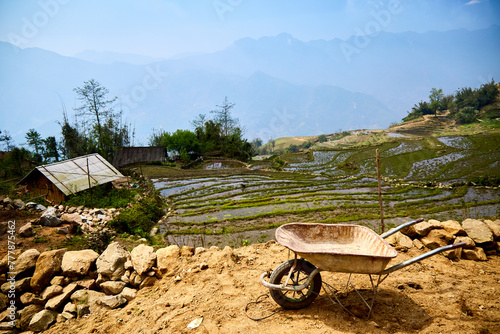 North Vietnam rice paddy terrace smallholding, rest break in heat  photo