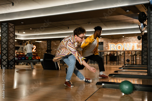 A men is playing bowling photo