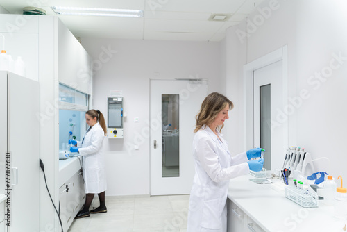Wallpaper Mural Researchers Working In Bright Lab Room Torontodigital.ca