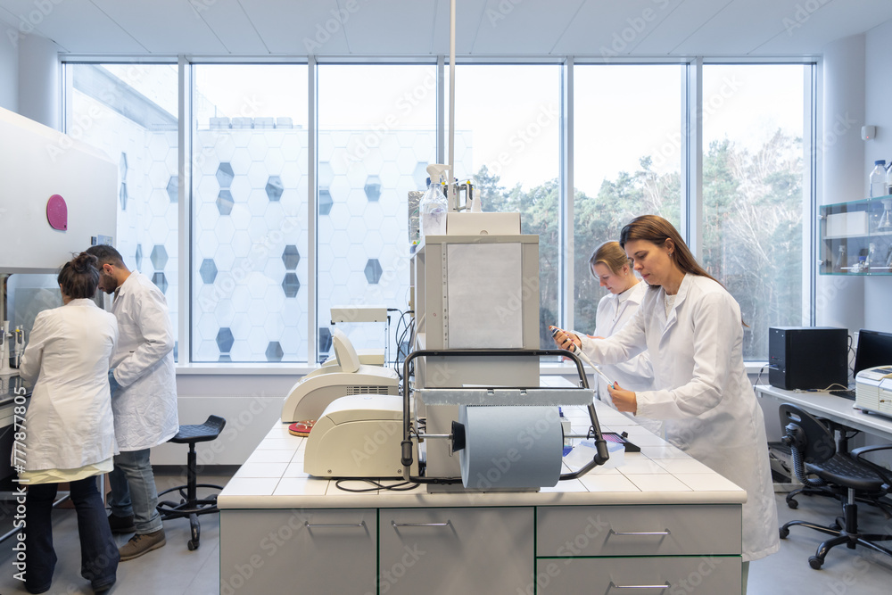Many Scientists Working In Bright Lab Room Many Scientists Working In Bright Lab Room