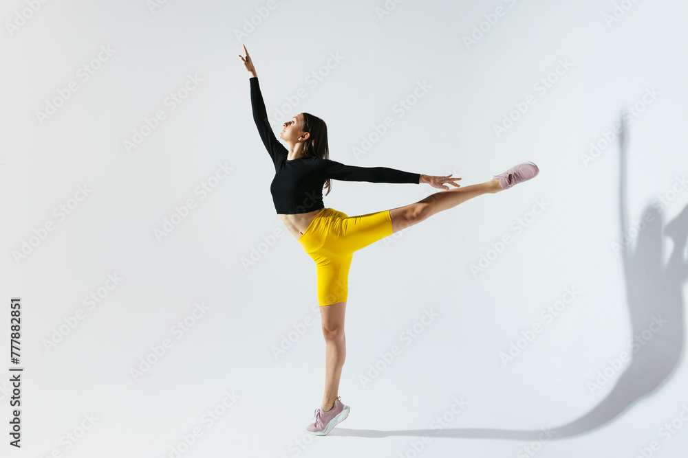 © BONNINSTUDIO/Stocksy - Woman dancing in studio © BONNINSTUDIO/Stocksy - Woman dancing in studio
