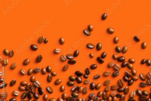 3D illustration of coffee beans on an orange background with Copyspace photo