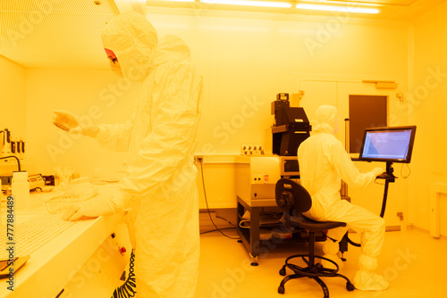 Scientists Working At Clean Room In The Laboratory photo