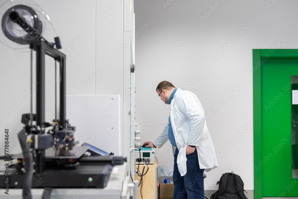 Scientist Working With Equipment In The Lab Scientist Working With Equipment In The Lab