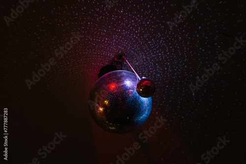 Disco balls reflecting light in a room photo