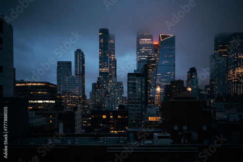 Midtown Manhattan skyline in twilight, glowing high rises
 photo