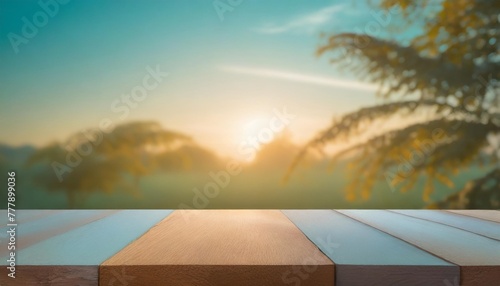 wood table top on blue abstract green from garden in the morning background for montage product display or design key