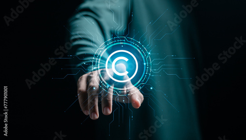 Businessman touching copyright icon for author rights and patented intellectual property. copyleft trademark license. Copyright or patent concept.