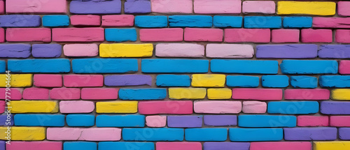 Colorful brick wall painted in various shades of pink, blue, purple, and yellow, wide panoramic background