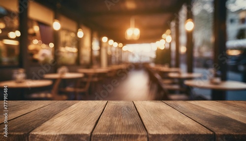 empty wood table top and blur of cafe restaurant in dark night background generative ai