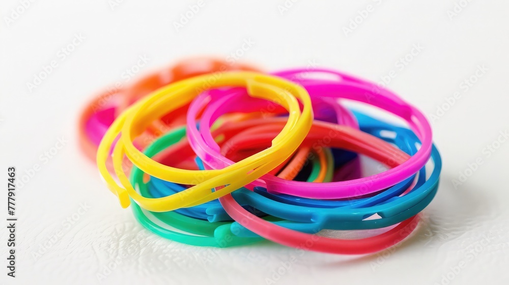 Rainbow loom- Colored rubber bands for weaving accessories on a white background, Heap office colorful rubber bands on white background
rubber bands isolated on white background. colorful rubber bands