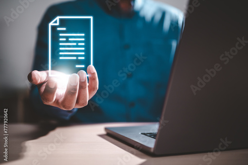 paperwork, report, data, document, management, marketing, research, innovation, working, system. A man is holding a paper. Concept of working on a project or document on a computer.