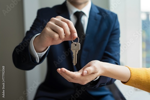 Passing keys symbolizes transition to new home and fresh start photo