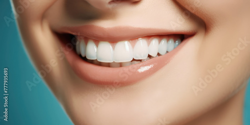 Closeup of woman with beautiful smile and white teeth, isolated on blue background. Teeth whitening, Dentist treatment, dental health - concept