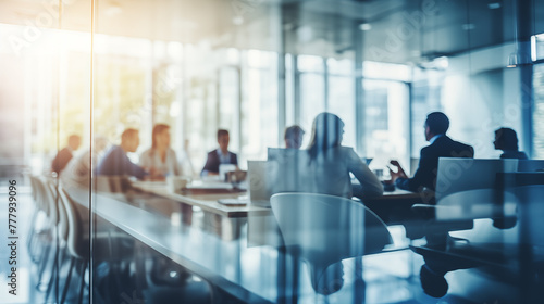 Blurry Office Meeting Through Glass Wall: Focusing on Corporate Teamwork and Workplace Dynamics.