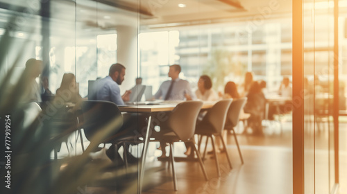 Blurry Office Meeting Through Glass Wall: Focusing on Corporate Teamwork and Workplace Dynamics.