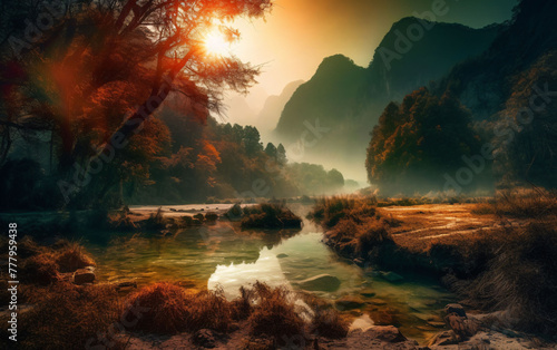 Sunrise over the river. A river flows through a valley, framed by mountains in the background. © Much