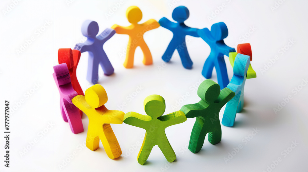 Colorful foam figures of people holding hands on a white background symbolize cooperation, support and teamwork.