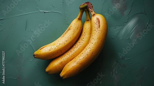 A bunch of bananas on a dark green background.