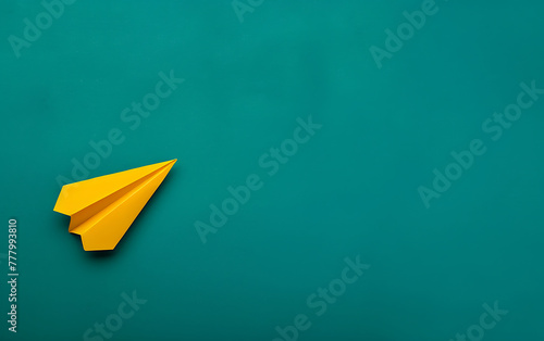 Top view of paper airplane origami on green background with space for text . Business innovative Leadership skills concept copy space.