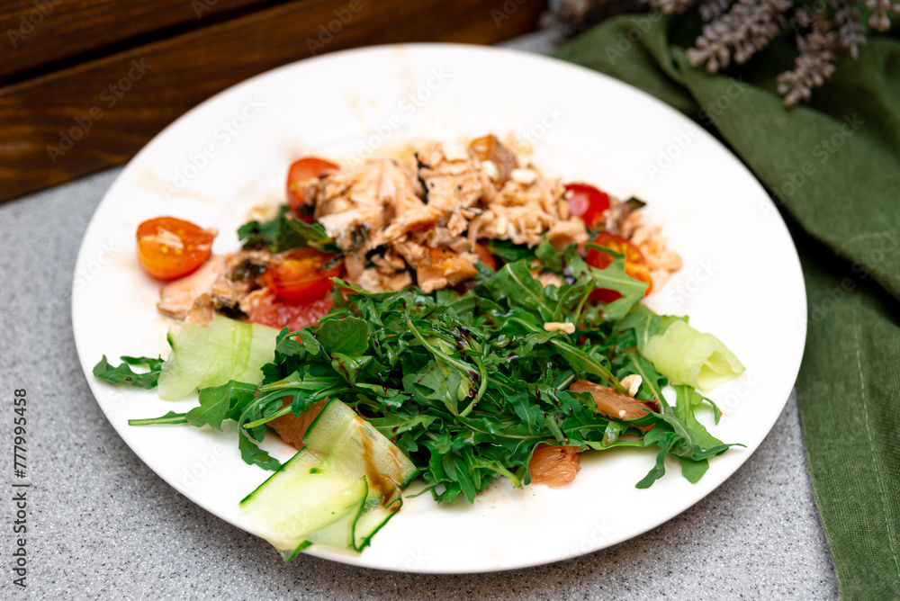 Tuna Salad with Arugula and Cherry Tomatoes. A healthful plate of tuna salad with fresh arugula leaves, cherry tomatoes, and cucumber slices, perfect for a nutritious meal. Tuna Salad with Arugula and Cherry Tomatoes. A healthful plate of tuna salad with fresh arugula leaves, cherry tomatoes, and cucumber slices, perfect for a nutritious meal.