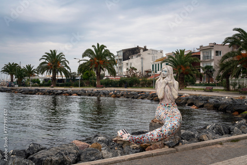 Mosaic sculpture of a mermaid on the promenade along the Marmara Sea on the Buyukada island of the Prince Islands, Istanbul, Turkey photo