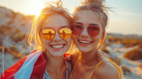 Two Women Smiling in Sunglasses