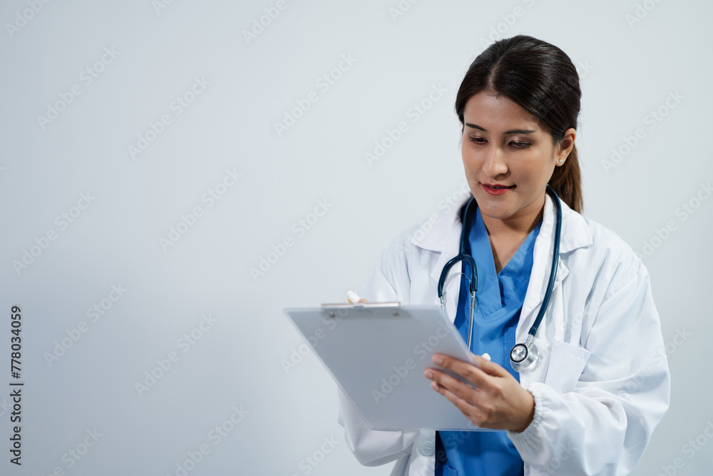 Doctor using clipboard and digital tablet find information patient medical history at the hospital. Medical technology concept. Doctor using clipboard and digital tablet find information patient medical history at the hospital. Medical technology concept.