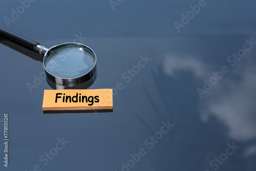 Post-it note with the word FINDINGS. Business and financial audit concept