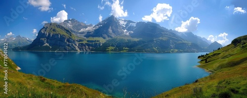 a natural scene with the lake, green sides of mountains and blue water