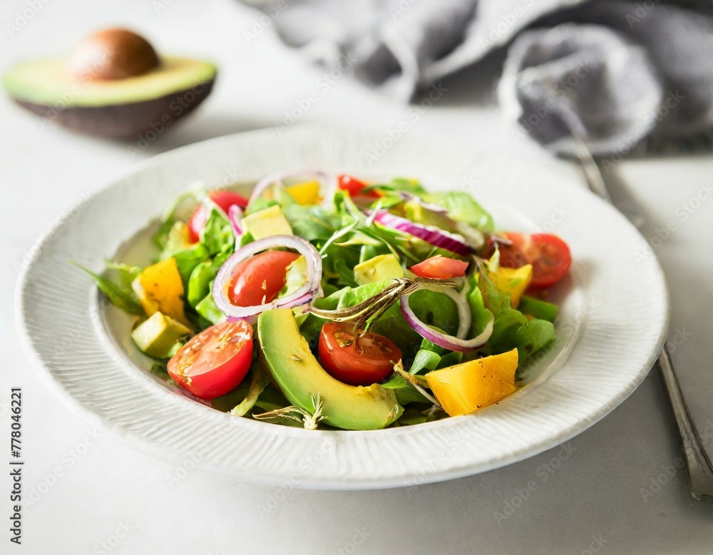 A vibrant salad featuring chunks of avocado, mixed greens, cherry tomatoes, and red onion, dressed lightly, served on a white porcelain plate, emphasizing health and freshness A vibrant salad featuring chunks of avocado, mixed greens, cherry tomatoes, and red onion, dressed lightly, served on a white porcelain plate, emphasizing health and freshness