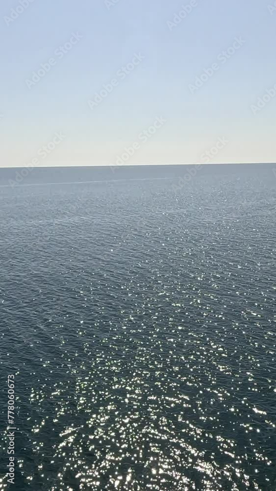 Sea water surface. Aerial view, camera flies over clear sea water. Nobody. Holiday recreation concept. Abstract nautical summer ocean nature. Slow motion. Close up. Vertical video Sea water surface. Aerial view, camera flies over clear sea water. Nobody. Holiday recreation concept. Abstract nautical summer ocean nature. Slow motion. Close up. Vertical video