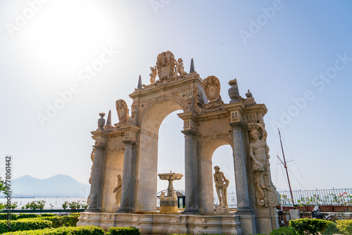 Naples, Italy. Fontana del Gigante - A monumental white stone fountain designed by Italian sculptor Pietro Bernini in the 17th century. Sunny summer morning