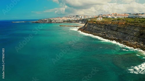 Drone view to Beautiful coastline Atlantic ocean . Aerial view - Beautiful travel destination with ocean rocky shore. Tourist place for surfing  while vacation at Ericeira, Portugal Touristic city. photo