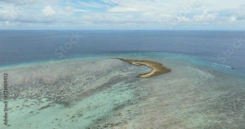 Islet on a coral reef. Atoll in the sea. Tun Sakaran Marine Park. Borneo, Sabah, Malaysia. photo