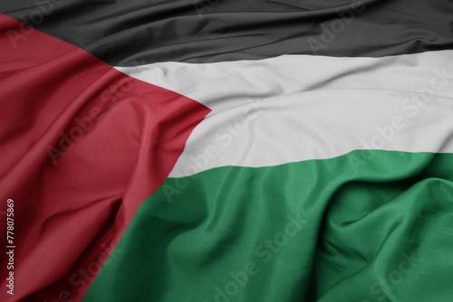 waving colorful national flag of palestine. © luzitanija