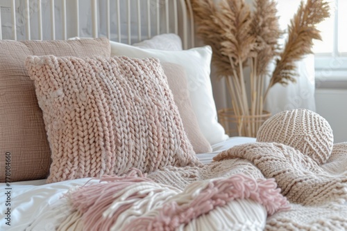 Cozy and Stylish Bedroom Interior with Elegant Decorative Pillows and Warm Chunky Knit Throw Blanket
