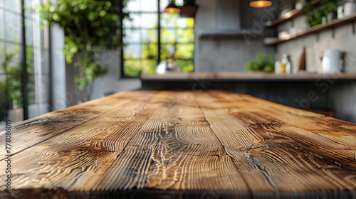 Wood table top on blurred kitchen background. can be used mock up for montage products display or design layout. photo