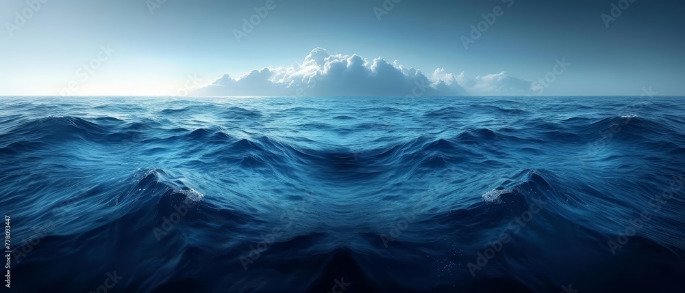 Fototapeta premium a large body of water with waves in the foreground and a large cloud in the sky in the background.