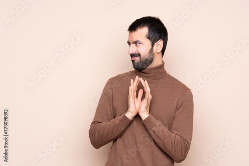 Man over isolated background scheming something