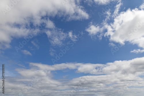 Capture the essence of tranquility with this beautiful sky, where fluffy clouds scatter across the endless blue, creating a perfect backdrop for artistic endeavors