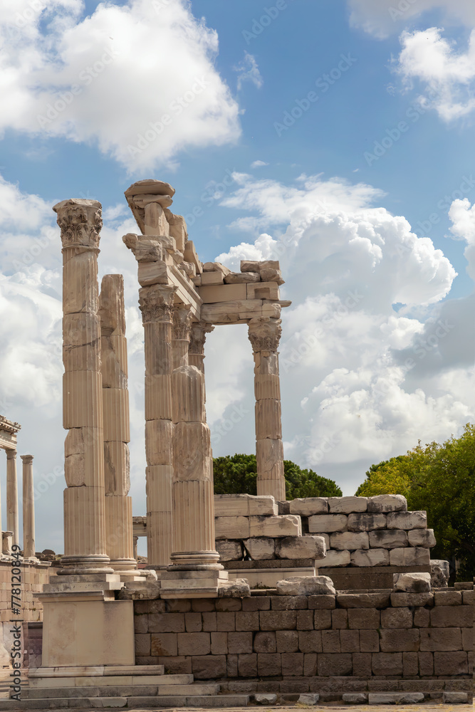 Temple of Trajan columns at Pergamon, essence of ancient Greek and Roman architectural grandeur. Scenic sky at background. History, art or architecture concept. Bergama (Izmir), Turkey (Turkiye)