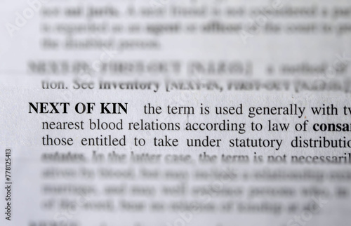 close up photo of the words next of kin