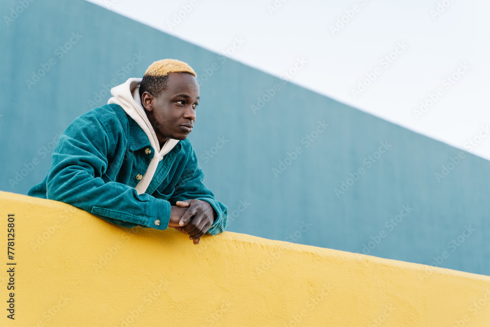 Young African American man with casual look . Trendy Generation Z young back man alone Young African American man with casual look . Trendy Generation Z young back man alone