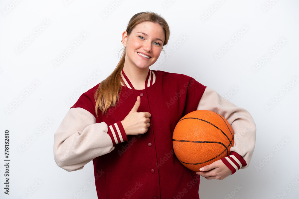 Young basketball player woman isolated on white background giving a thumbs up gesture Young basketball player woman isolated on white background giving a thumbs up gesture