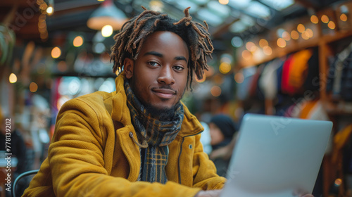 Man Using Laptop at Table