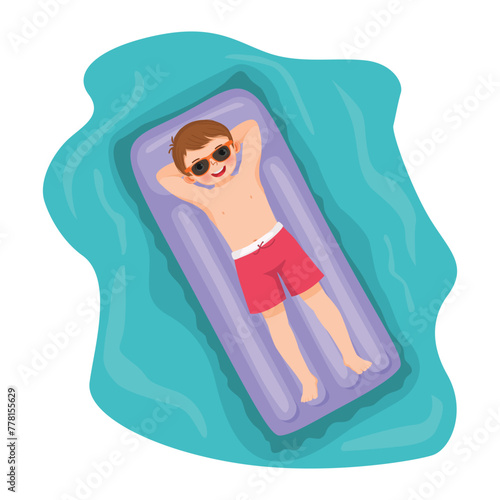 Cute little boy in swimsuit sunbathing having fun lying on inflatable mattress